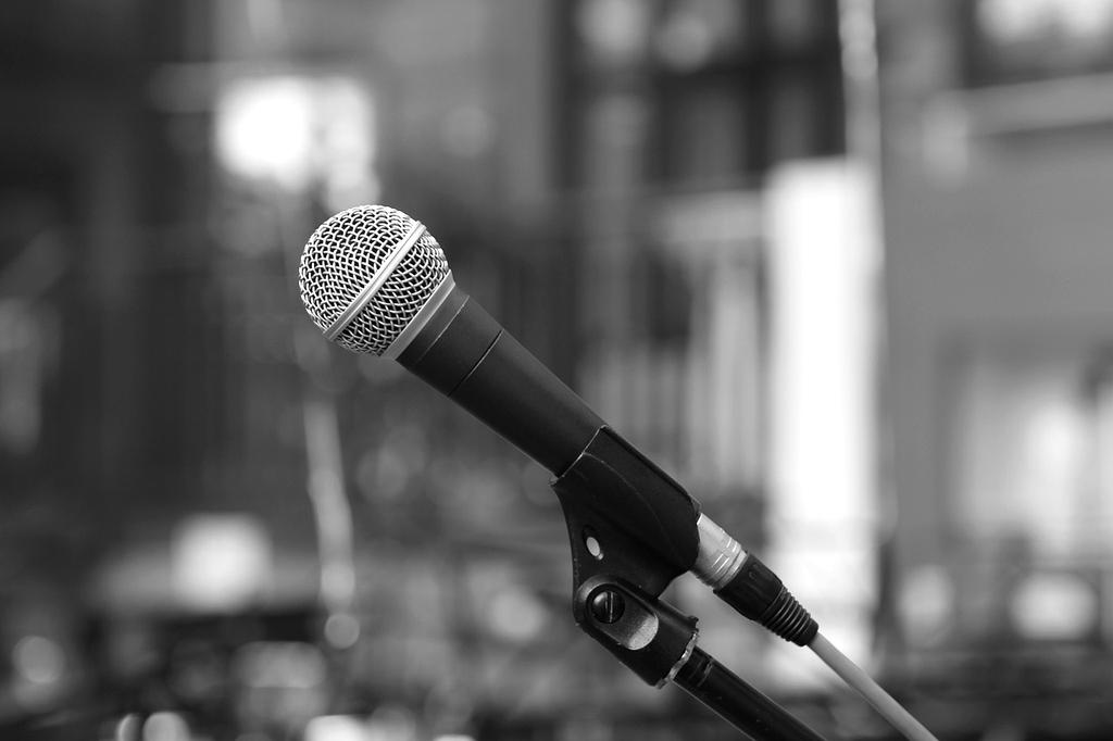 Person interacting with a voice assistant on a smart device